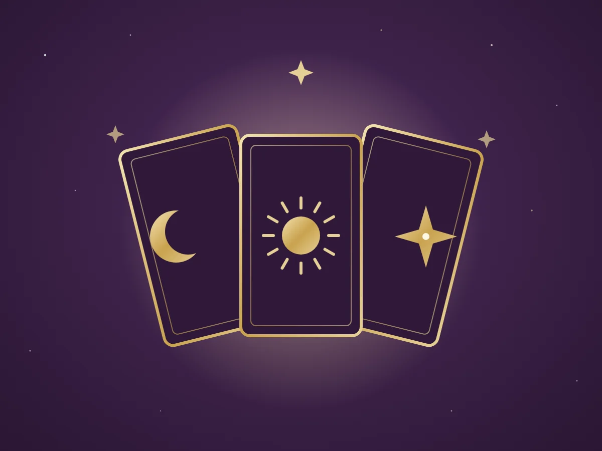 Three gold tarot cards showing the moon, sun and a star